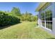 A large yard with a lush lawn surrounds this home at 1404 Newry Cir, Ormond Beach, FL 32174