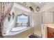 Relaxing bathroom with a soaking tub, separate shower, and decorative accents at 1404 Newry Cir, Ormond Beach, FL 32174