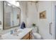 Neat bathroom featuring a long vanity with storage, a toilet, and a tiled shower at 1404 Newry Cir, Ormond Beach, FL 32174