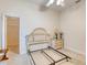 Bright bedroom with neutral carpet, white walls, and a window for natural light at 1404 Newry Cir, Ormond Beach, FL 32174