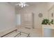Bright bedroom with neutral carpet, white walls, and a white dresser with mirror at 1404 Newry Cir, Ormond Beach, FL 32174