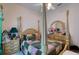 Bedroom with a four poster bed, carpet, side tables and ample closet space at 1404 Newry Cir, Ormond Beach, FL 32174