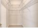 Empty walk-in closet with built-in wire shelving at 1404 Newry Cir, Ormond Beach, FL 32174