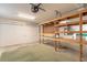 Ample garage space with built-in shelving and storage options at 1404 Newry Cir, Ormond Beach, FL 32174