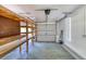 Well-lit garage featuring shelving units for storage and organization at 1404 Newry Cir, Ormond Beach, FL 32174