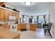 Bright kitchen features light wood cabinets, lots of counter space, and open flow to the living area at 1404 Newry Cir, Ormond Beach, FL 32174