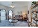 Comfortable living room with carpeting, large windows, and cozy furnishings at 1404 Newry Cir, Ormond Beach, FL 32174