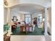 Open living room featuring decorative pillars, a neutral color scheme, and direct access to the outdoors at 1404 Newry Cir, Ormond Beach, FL 32174