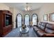 Well lit living room featuring soft carpet, lots of light, and cozy furniture at 1404 Newry Cir, Ormond Beach, FL 32174