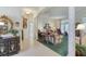 Elegant living room with stately columns, neutral walls, and large windows for ample natural light at 1404 Newry Cir, Ormond Beach, FL 32174