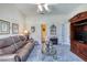 Cozy living room with plush carpeting, comfortable seating, and a decorative fireplace at 1404 Newry Cir, Ormond Beach, FL 32174