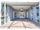 A covered patio with tile flooring and a ceiling fan provides a relaxing outdoor area at 1404 Newry Cir, Ormond Beach, FL 32174