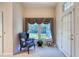 Cozy sitting area with a comfortable chair, a window with valances, and a view of the outdoors at 1404 Newry Cir, Ormond Beach, FL 32174