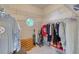 Walk-in closet with shelving, an octagon window, and lots of storage space at 1404 Newry Cir, Ormond Beach, FL 32174