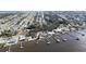 Waterfront community aerial view highlighting the neighborhood with boat docks and a serene river at 151 Holland Rd, Ormond Beach, FL 32176