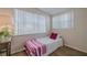 Well-lit bedroom featuring a twin bed, hardwood floors, and large window at 151 Holland Rd, Ormond Beach, FL 32176