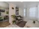 Inviting hallway with tiled floors, a cozy bench, and natural light from the window at 151 Holland Rd, Ormond Beach, FL 32176