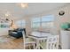 Cozy living room featuring a dining area, comfortable seating, and bright windows at 151 Holland Rd, Ormond Beach, FL 32176