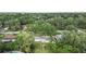 Aerial view of the home showcasing its location in a tree-lined neighborhood at 2120 Queen Palm Dr, Edgewater, FL 32141