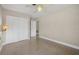 Bedroom with closet and ceiling fan at 2120 Queen Palm Dr, Edgewater, FL 32141