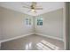 Cozy bedroom featuring a ceiling fan, natural lighting, and neutral colors at 2120 Queen Palm Dr, Edgewater, FL 32141