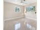 Bedroom with ample natural light, ceiling fan, and neutral décor at 2120 Queen Palm Dr, Edgewater, FL 32141