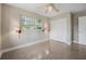 Bedroom with ceiling fan, closet and sconce lighting at 2120 Queen Palm Dr, Edgewater, FL 32141
