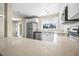 Bright kitchen with stainless appliances, white cabinets, and stone countertops at 2120 Queen Palm Dr, Edgewater, FL 32141