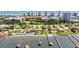 Aerial view showcases waterfront property with private dock, lush landscaping, and stunning city views at 2924 River Point Dr, Daytona Beach, FL 32118