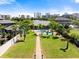 Beautiful backyard featuring a pool, green lawn, and walkway with city views at 2924 River Point Dr, Daytona Beach, FL 32118