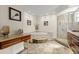 Luxurious bathroom boasts a jetted tub, glass-enclosed shower, and beautiful marble flooring at 2924 River Point Dr, Daytona Beach, FL 32118