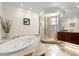 Elegant bathroom featuring a soaking tub, walk-in shower, and marble accents at 2924 River Point Dr, Daytona Beach, FL 32118