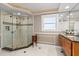 Bright bathroom featuring a glass shower and marble countertop vanity at 2924 River Point Dr, Daytona Beach, FL 32118