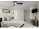 Cozy bedroom with a ceiling fan, neutral walls, carpet, and comfortable bed, creating a relaxing retreat at 2924 River Point Dr, Daytona Beach, FL 32118