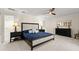Cozy bedroom with carpet flooring, ceiling fan, and dark wood furniture set at 2924 River Point Dr, Daytona Beach, FL 32118