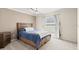 Cozy bedroom with a ceiling fan, window, and neutral-colored walls at 2924 River Point Dr, Daytona Beach, FL 32118