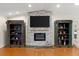 Living room fireplace with stone surround, display shelves, and electric fireplace insert at 2924 River Point Dr, Daytona Beach, FL 32118