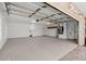 Spacious garage with epoxy flooring, storage cabinets, and ample room for vehicles and projects at 2924 River Point Dr, Daytona Beach, FL 32118