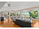 Cozy living area with large windows offering a picturesque waterfront view and lush greenery at 2924 River Point Dr, Daytona Beach, FL 32118