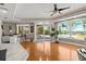 Bright living room featuring wood floors, recessed lighting, bar seating, and water views at 2924 River Point Dr, Daytona Beach, FL 32118