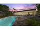 Beautiful backyard oasis featuring a sparkling pool, spa, and ample patio space for relaxation and entertaining at 2924 River Point Dr, Daytona Beach, FL 32118