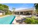 Swimming pool and patio area, complete with a spa, lounge chairs, and a view of the backyard at 2924 River Point Dr, Daytona Beach, FL 32118