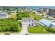 Aerial view of a beautiful home surrounded by greenery and the ocean at 32 Ocean Breeze Cir, Ormond Beach, FL 32176