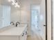 Bright bathroom with marble countertop, white cabinets, and modern fixtures at 32 Ocean Breeze Cir, Ormond Beach, FL 32176