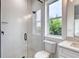 Bright bathroom featuring tiled shower, modern fixtures, and a window providing natural light at 32 Ocean Breeze Cir, Ormond Beach, FL 32176