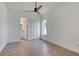 A bedroom featuring a modern ceiling fan, closet and a view into the ensuite bathroom at 32 Ocean Breeze Cir, Ormond Beach, FL 32176