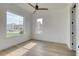 A bedroom with laminate flooring and 2 windows providing natural light at 32 Ocean Breeze Cir, Ormond Beach, FL 32176
