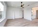 Open bedroom design featuring wood floors, modern ceiling fan, and bright, airy atmosphere at 32 Ocean Breeze Cir, Ormond Beach, FL 32176