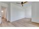 Bedroom with light wood floors, a ceiling fan, and a doorway at 32 Ocean Breeze Cir, Ormond Beach, FL 32176