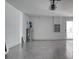 Clean and empty two car garage with a painted floor at 32 Ocean Breeze Cir, Ormond Beach, FL 32176